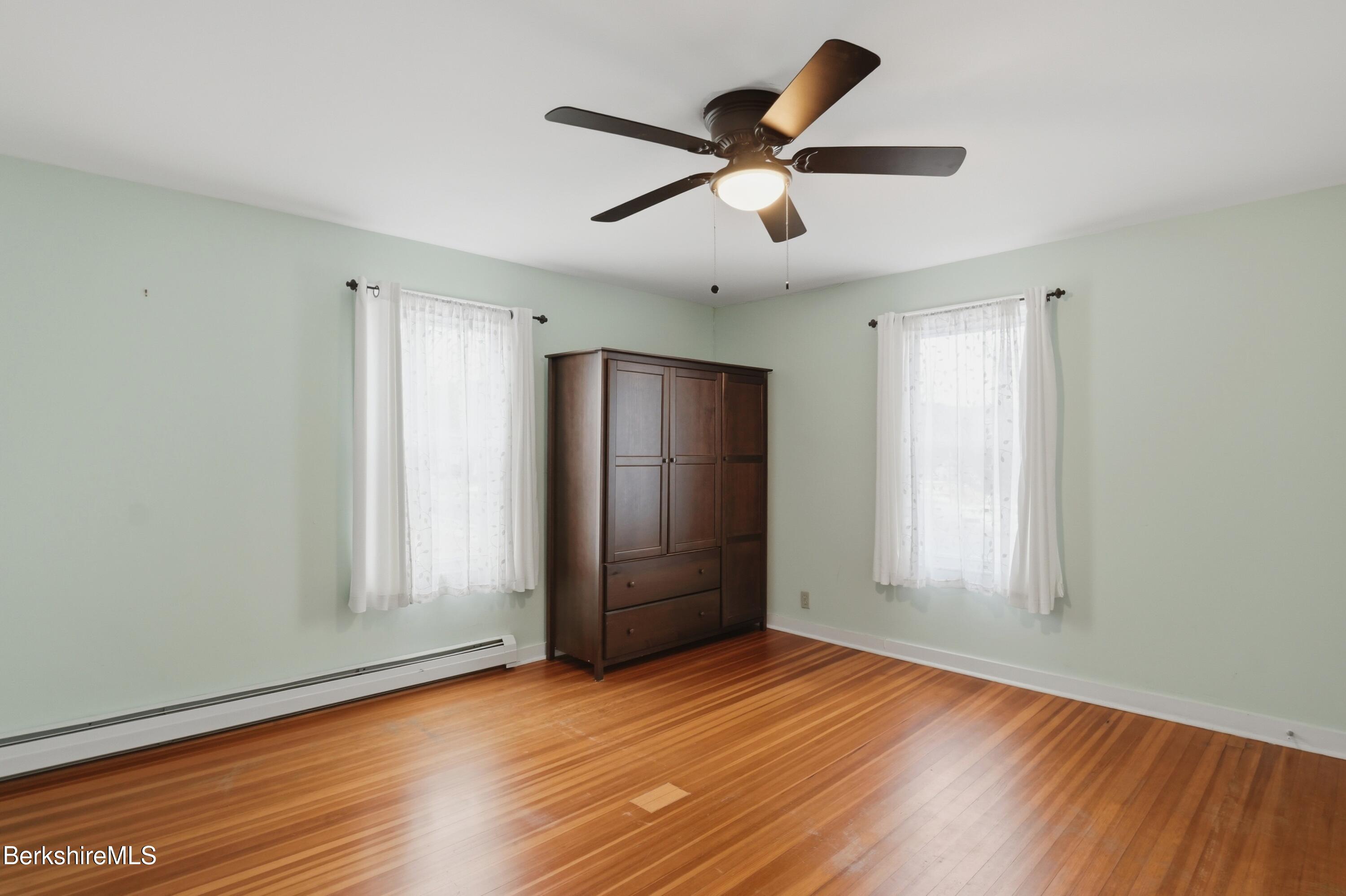 165 High Street Dalton, MA 01226 - Photo 20 of 38 an empty room with wooden floor and windows