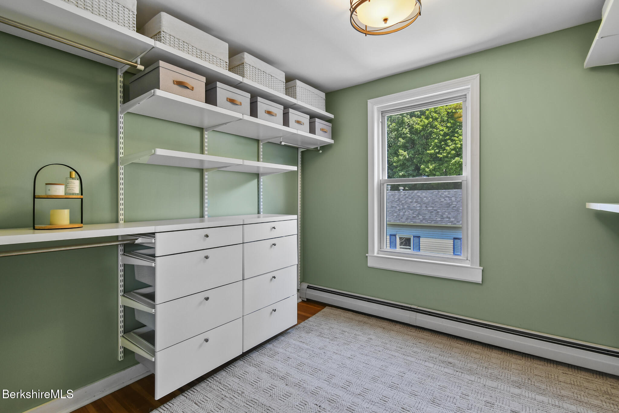 165 High Street Dalton, MA 01226 - Photo 23 of 38 a view of an empty room with a window and cabinet