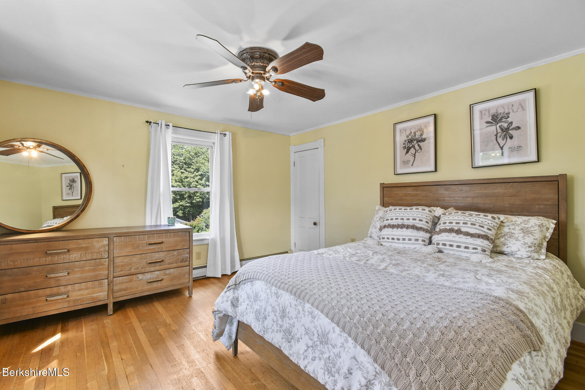 165 High Street Dalton, MA 01226 - Photo 27 of 38 a bedroom with a bed and a chandelier