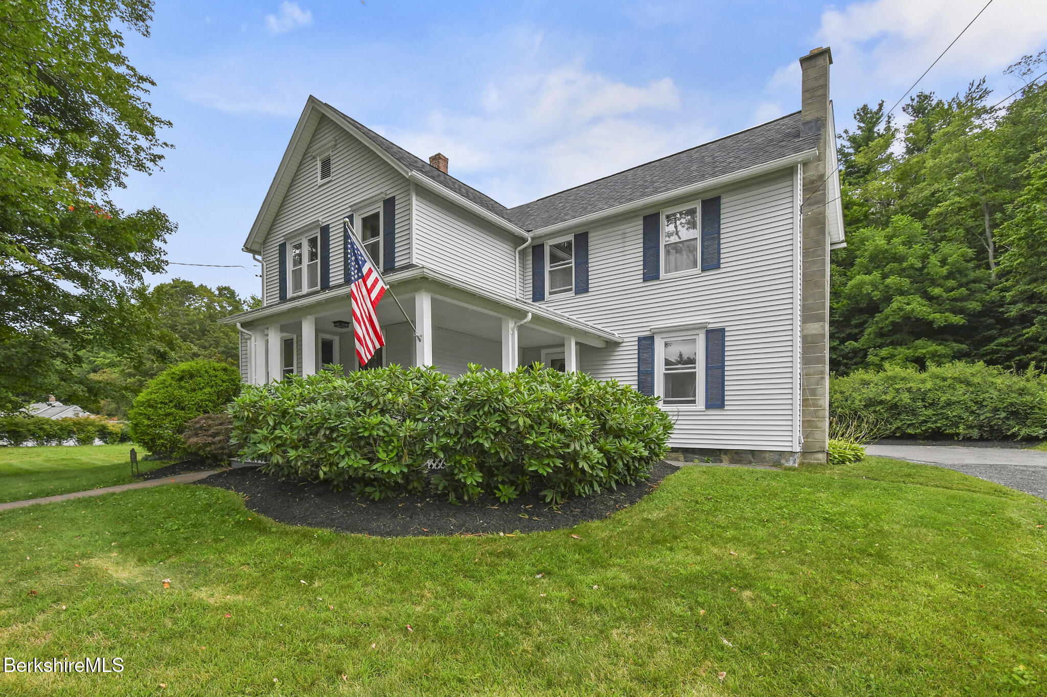 165 High Street Dalton, MA 01226 - Photo 3 of 38 a front view of a house with garden