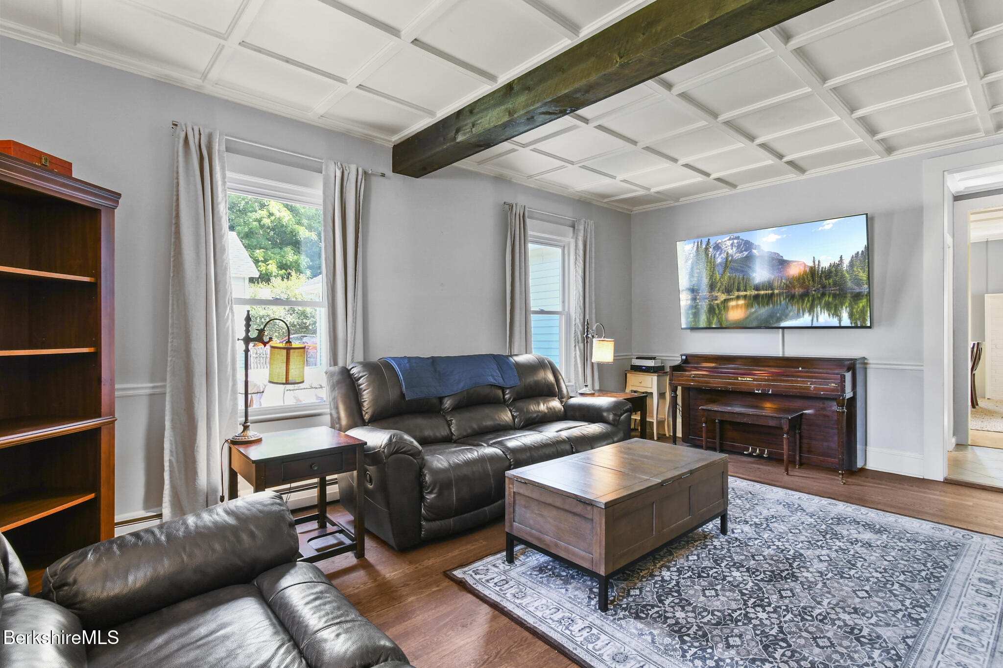 165 High Street Dalton, MA 01226 - Photo 7 of 38 a living room with furniture and a flat screen tv