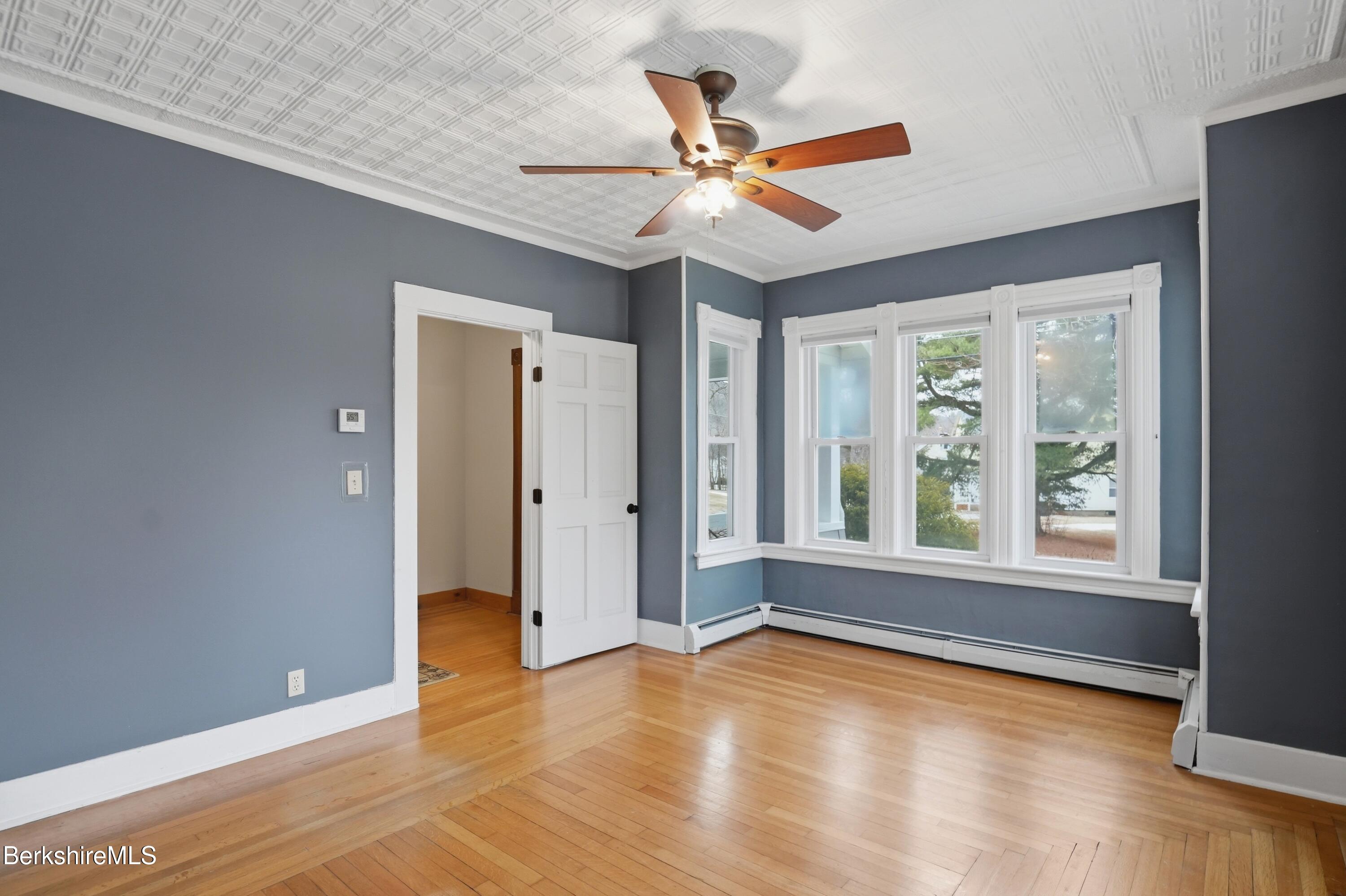 165 High Street Dalton, MA 01226 - Photo 10 of 38 a view of an empty room with wooden floor and a window