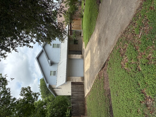 404 West 24th Street Bryan, TX 77803 - Photo 1 of 22 a front view of house with yard and green space