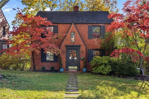 front view of a house with a small yard