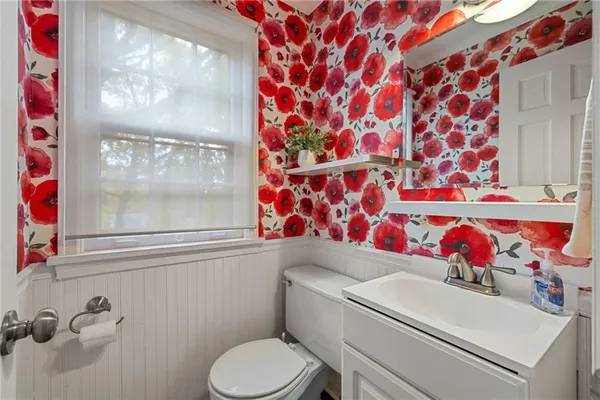 a bathroom with a sink and toilet