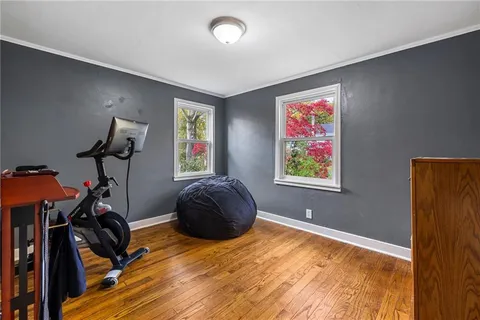 a bedroom with furniture and a window