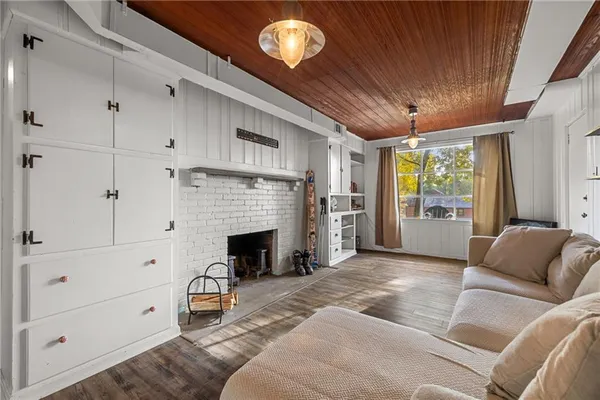 a living room with furniture and a fireplace