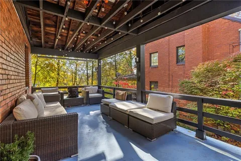 a outdoor living space with furniture and garden view