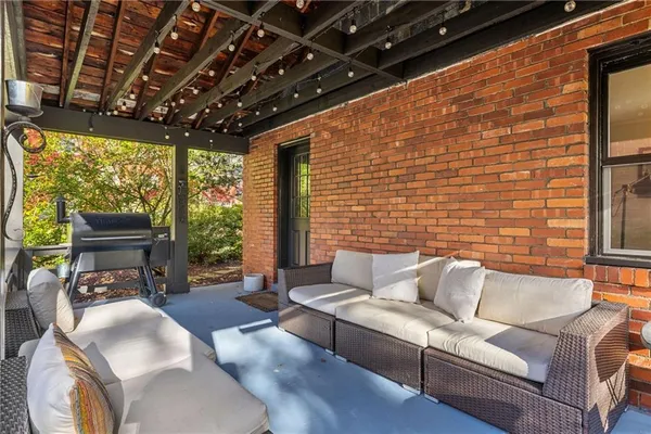 a outdoor living space with furniture and garden view