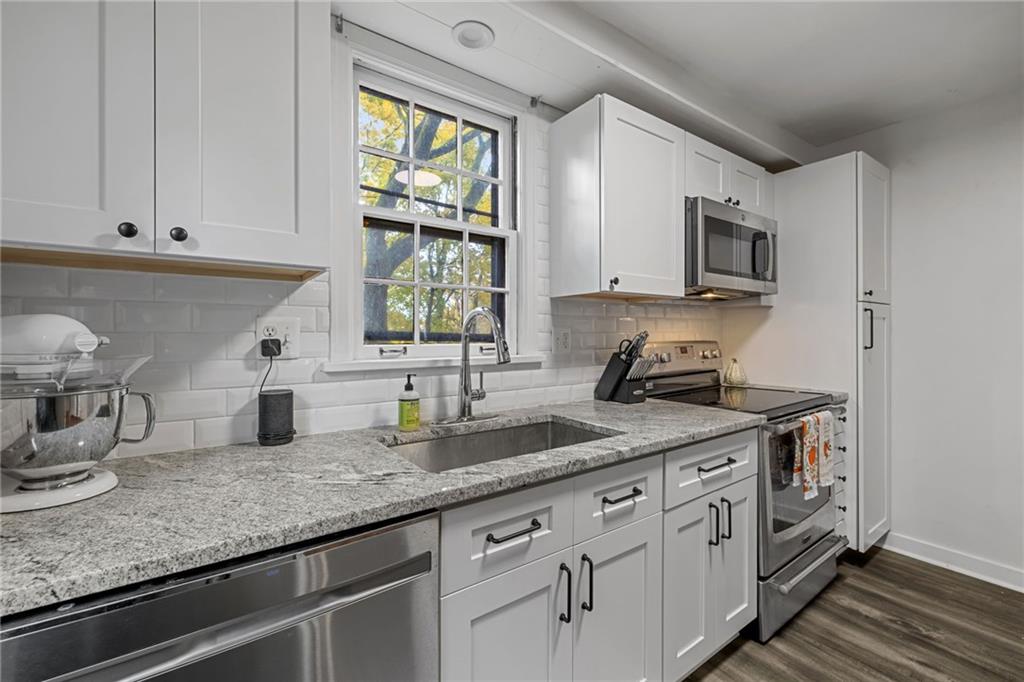 747 Fruithurst Drive Pittsburgh, PA 15228 - Photo 10 of 39 a kitchen with appliances a sink and a window