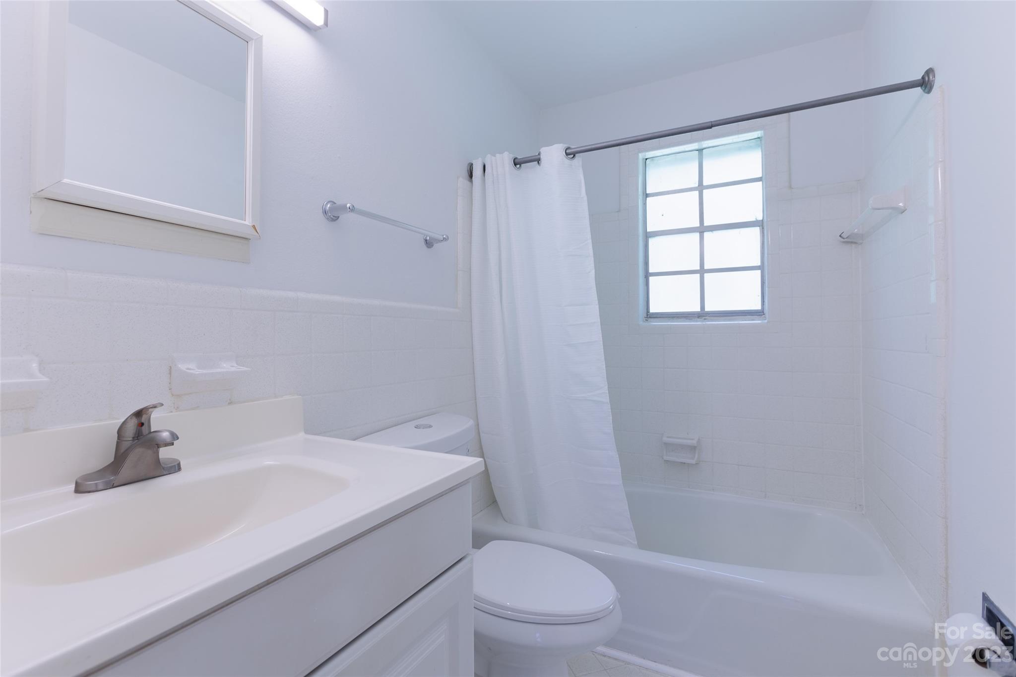 4319 Walker Road, Unit C Charlotte, NC 28211 - Photo 10 of 13 a bathroom with a sink toilet and shower