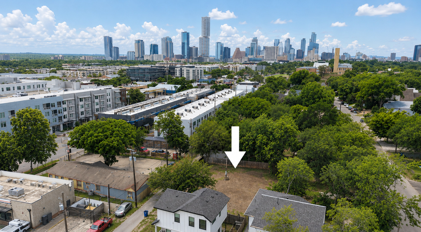 2017 East 8th Street Austin, TX 78702 - Photo 4 of 7 A prime lot opportunity with city views, nestled amidst green trees.