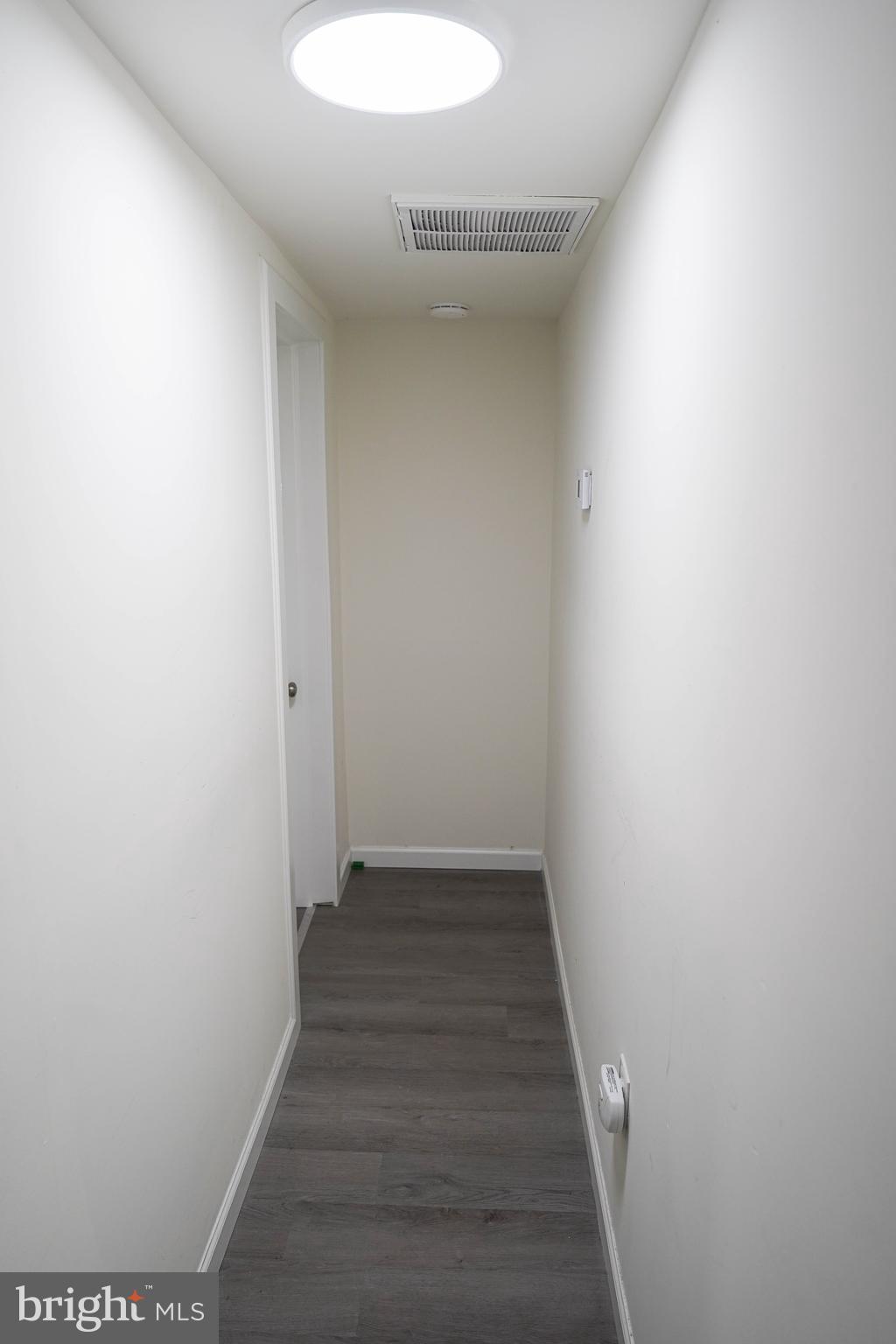231 Newton Street, Unit B Salisbury, MD 21801 - Photo 13 of 31 a view of a hallway with wooden floor