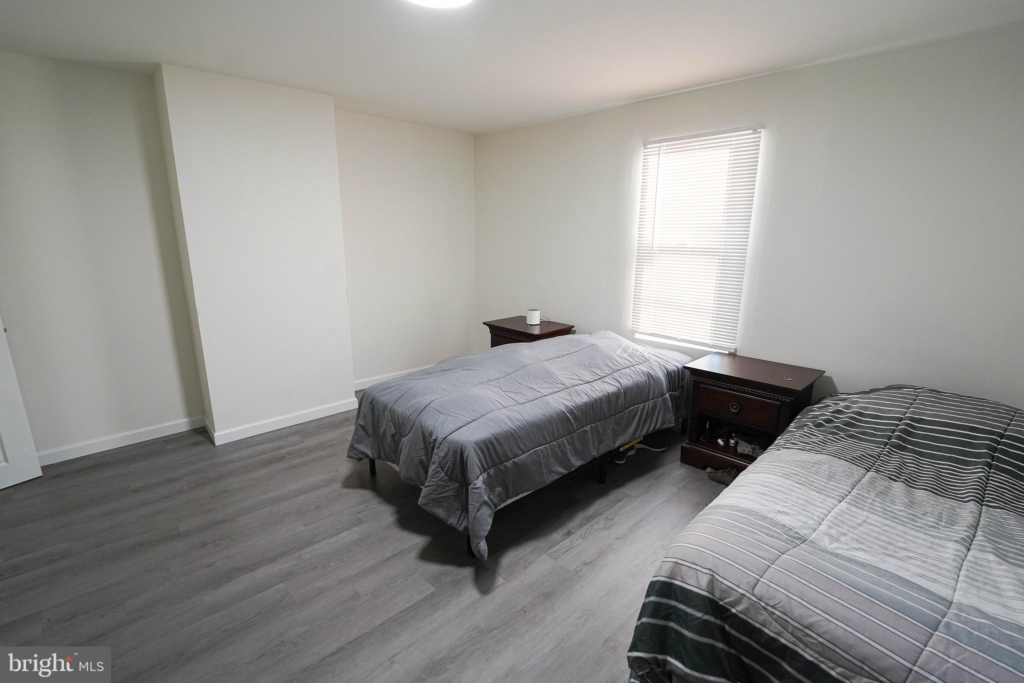 231 Newton Street, Unit B Salisbury, MD 21801 - Photo 25 of 31 a bedroom with a bed and a window