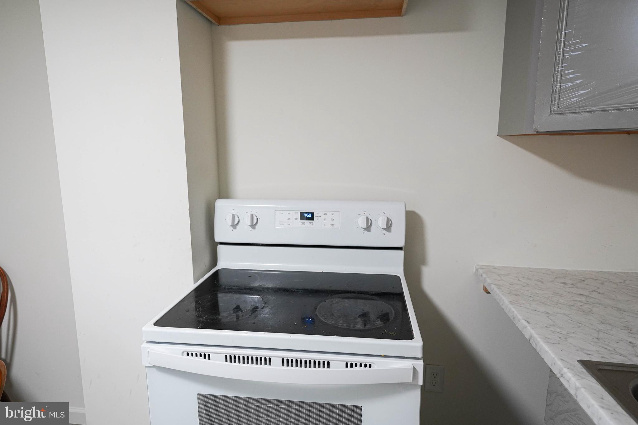 231 Newton Street, Unit B Salisbury, MD 21801 - Photo 29 of 31 a stove top oven sitting inside of a kitchen