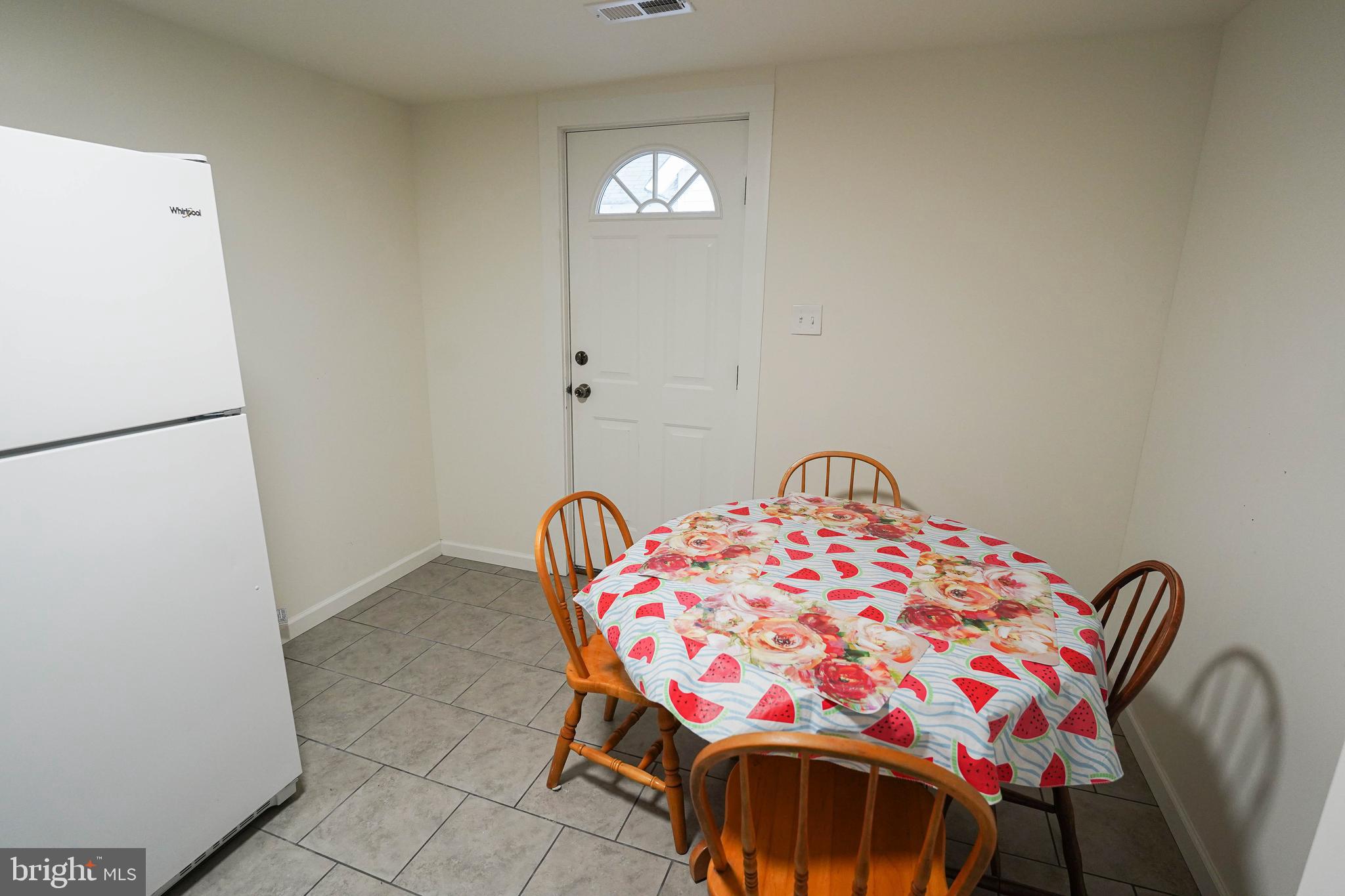231 Newton Street, Unit B Salisbury, MD 21801 - Photo 30 of 31 a bedroom with a bed and a table in it