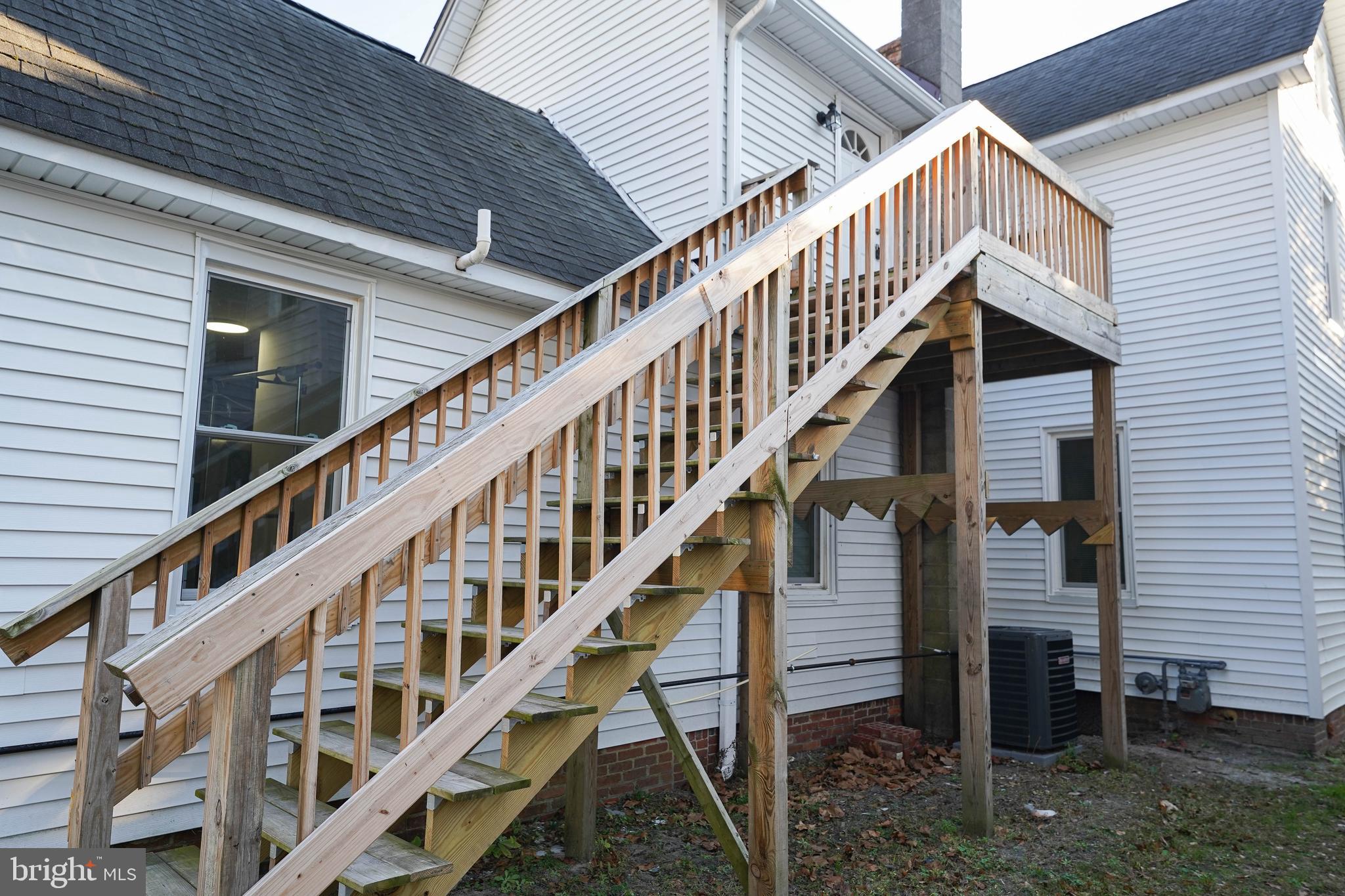 231 Newton Street, Unit B Salisbury, MD 21801 - Photo 3 of 31 a view of staircase with railing and white walls