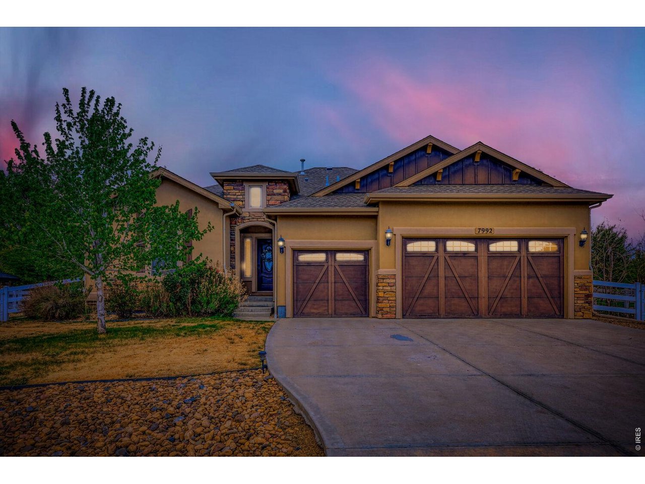 7992 St Street Frederick, CO 80530 - Photo 1 of 28 a front view of a house with a garden