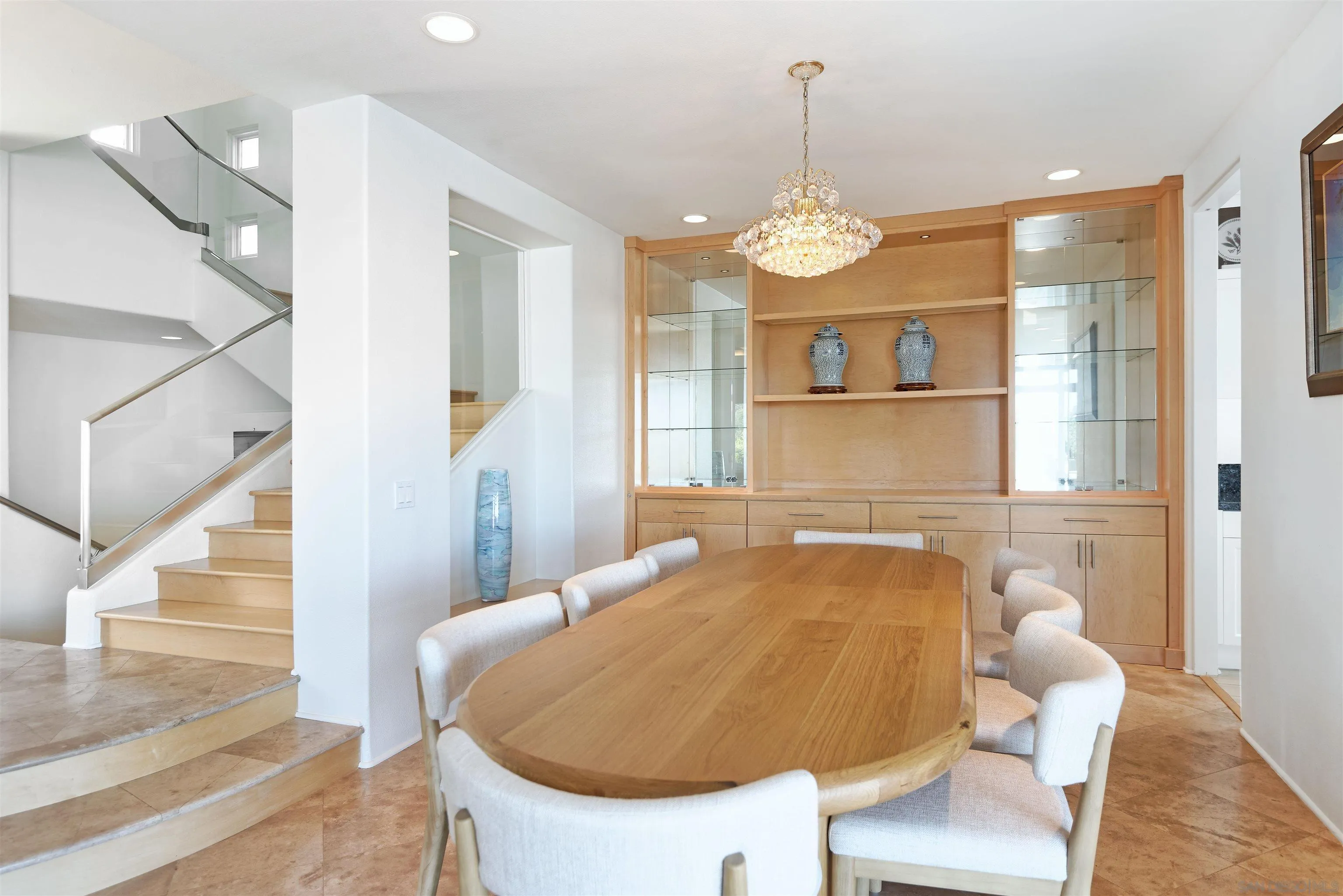 7825 Prospect Place La Jolla, CA 92037 - Photo 11 of 32 a view of a dining room with a table and chairs
