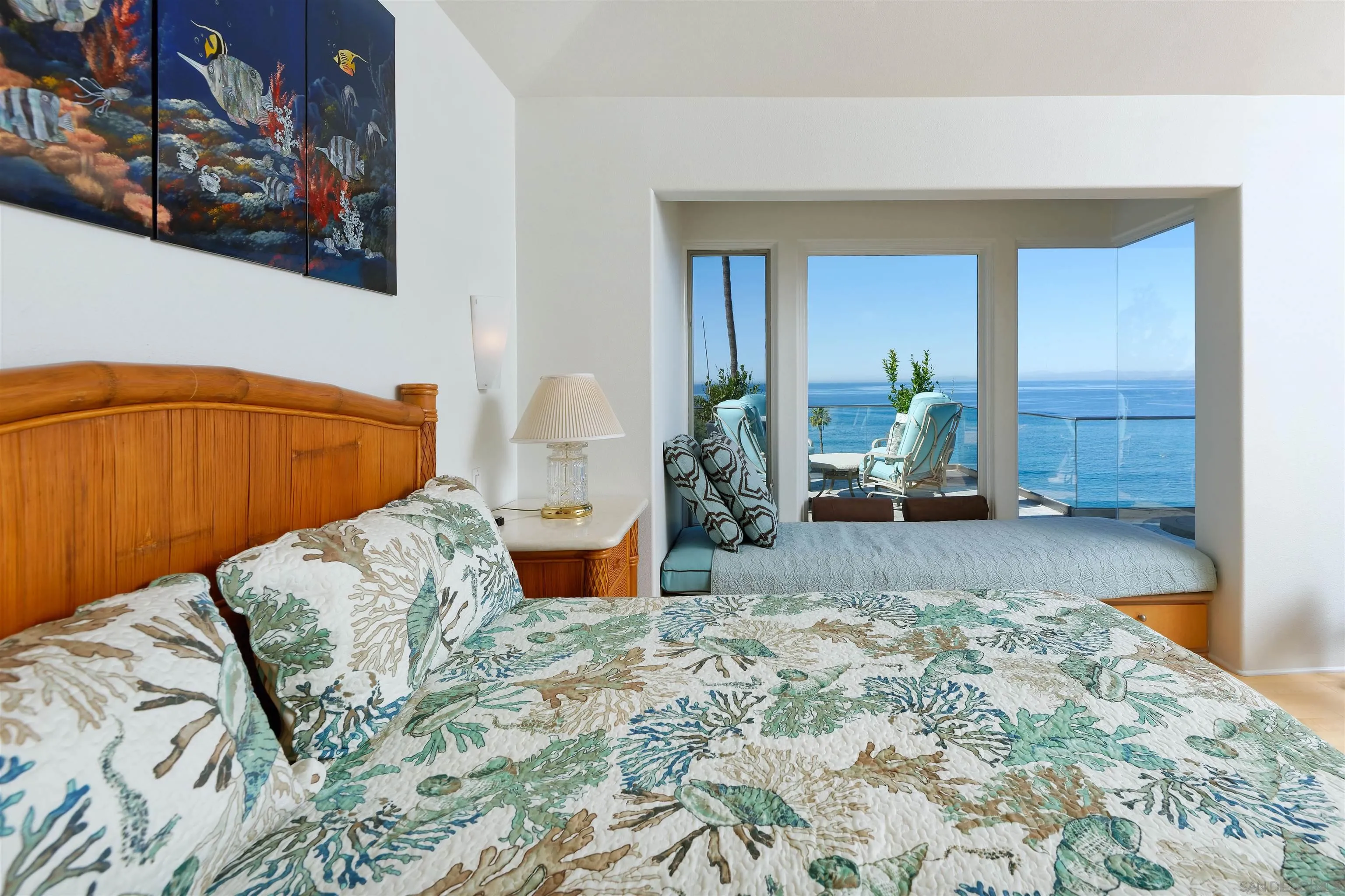 7825 Prospect Place La Jolla, CA 92037 - Photo 13 of 32 a bedroom with a bed and a painting on the wall