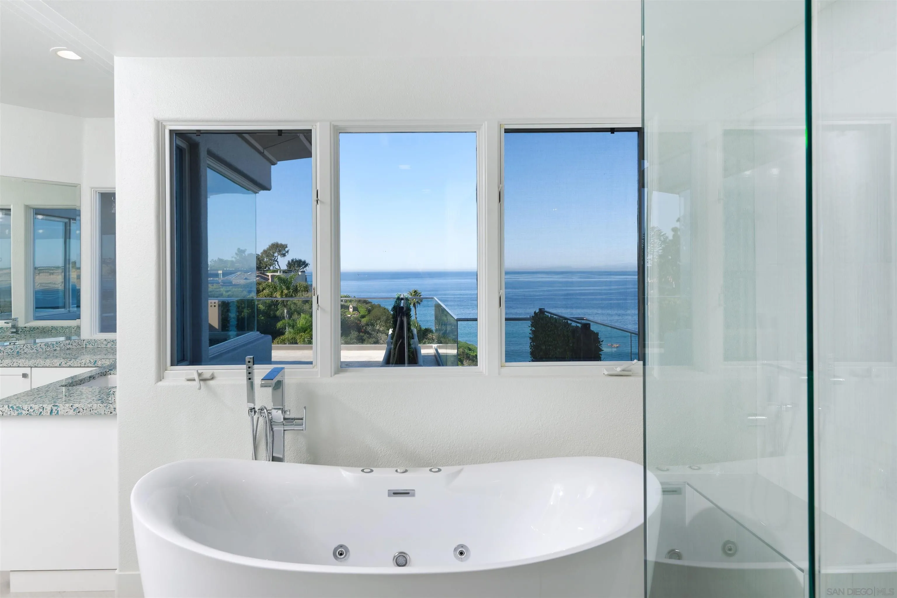 7825 Prospect Place La Jolla, CA 92037 - Photo 15 of 32 a white bath tub sitting in a bathroom