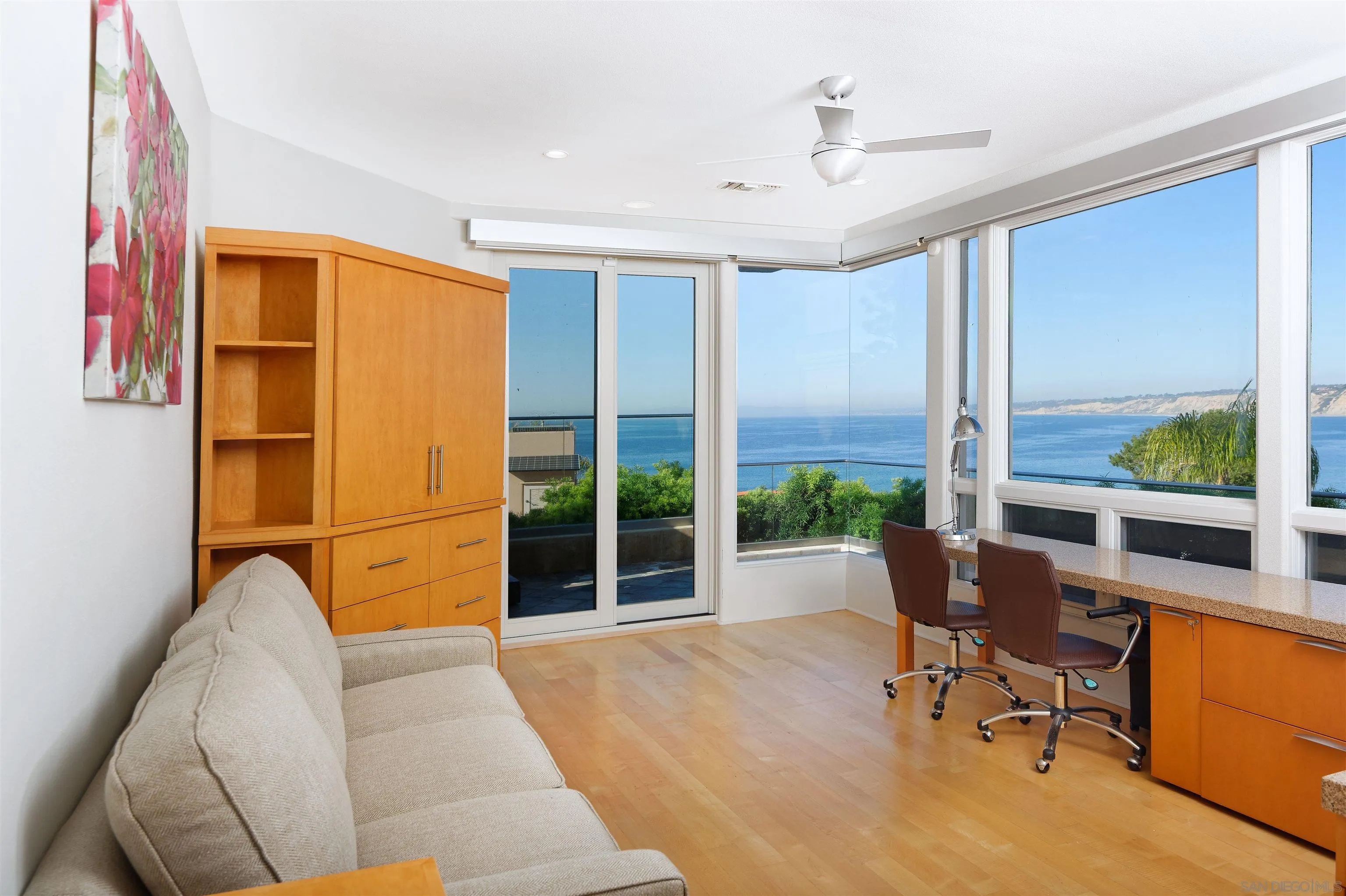 7825 Prospect Place La Jolla, CA 92037 - Photo 19 of 32 a living room with furniture and a window