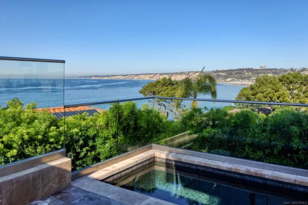 a view of a back yard from a balcony