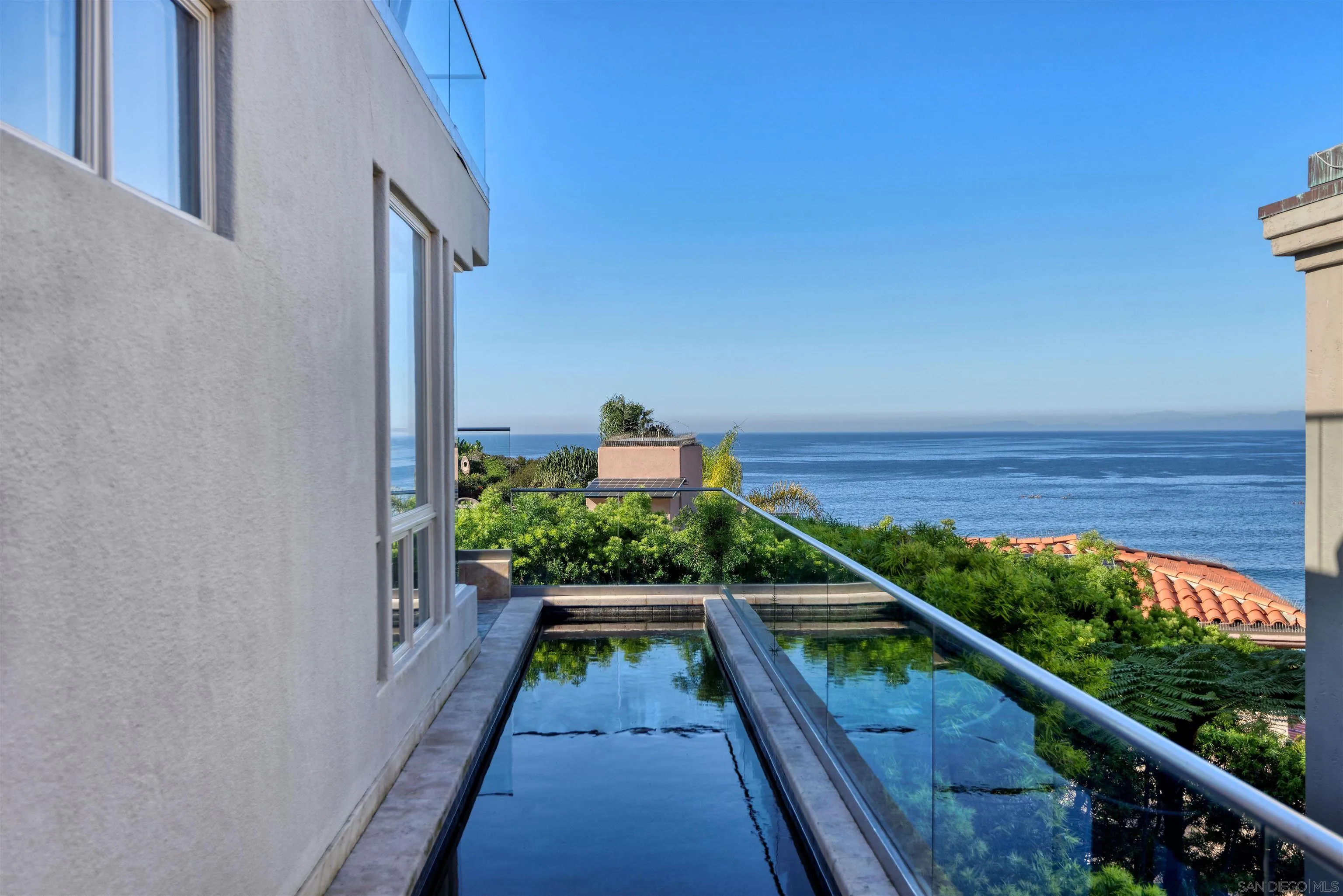 7825 Prospect Place La Jolla, CA 92037 - Photo 24 of 32 a balcony with wooden floor and outdoor space