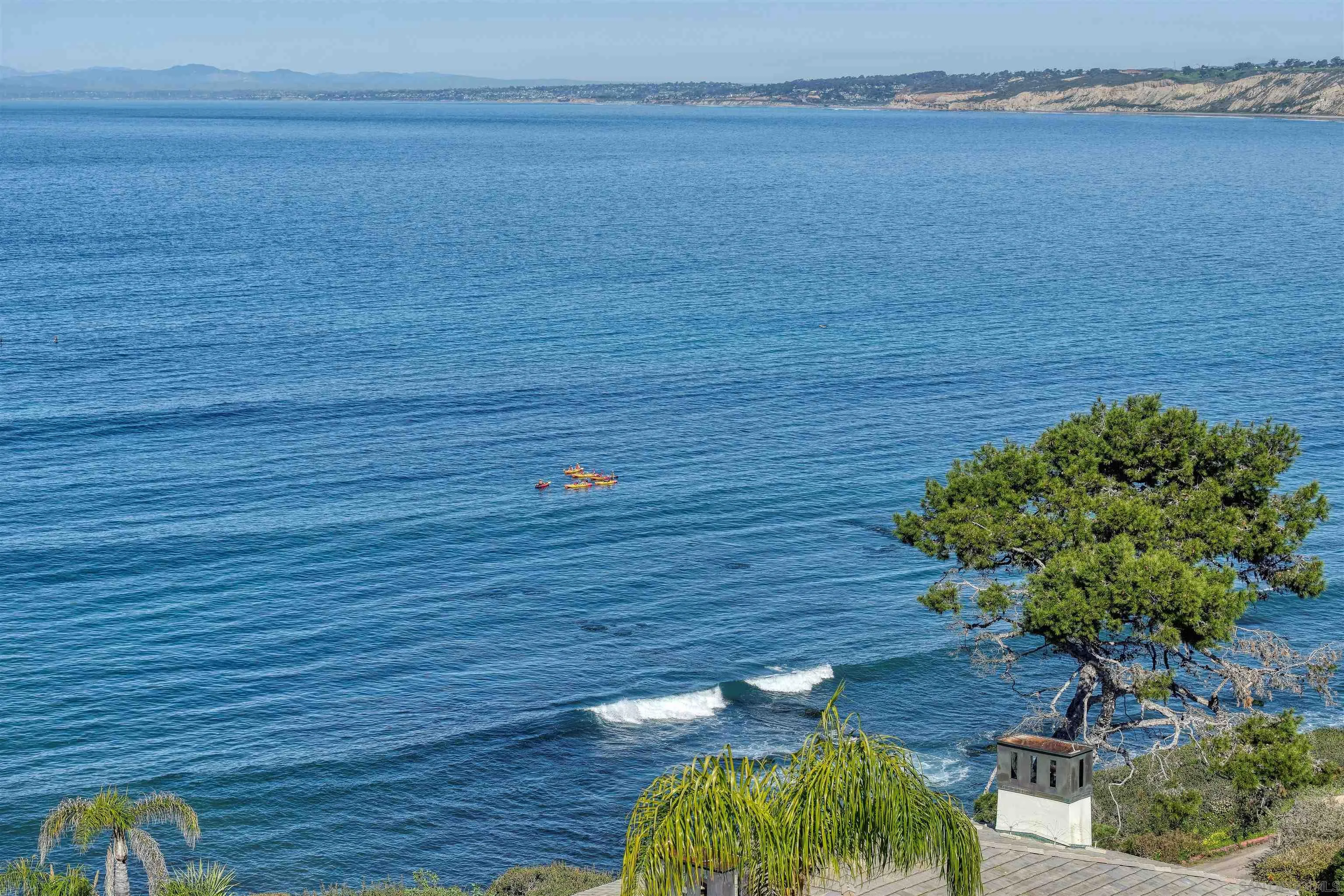 7825 Prospect Place La Jolla, CA 92037 - Photo 26 of 32 a view of a terrace with wooden floor
