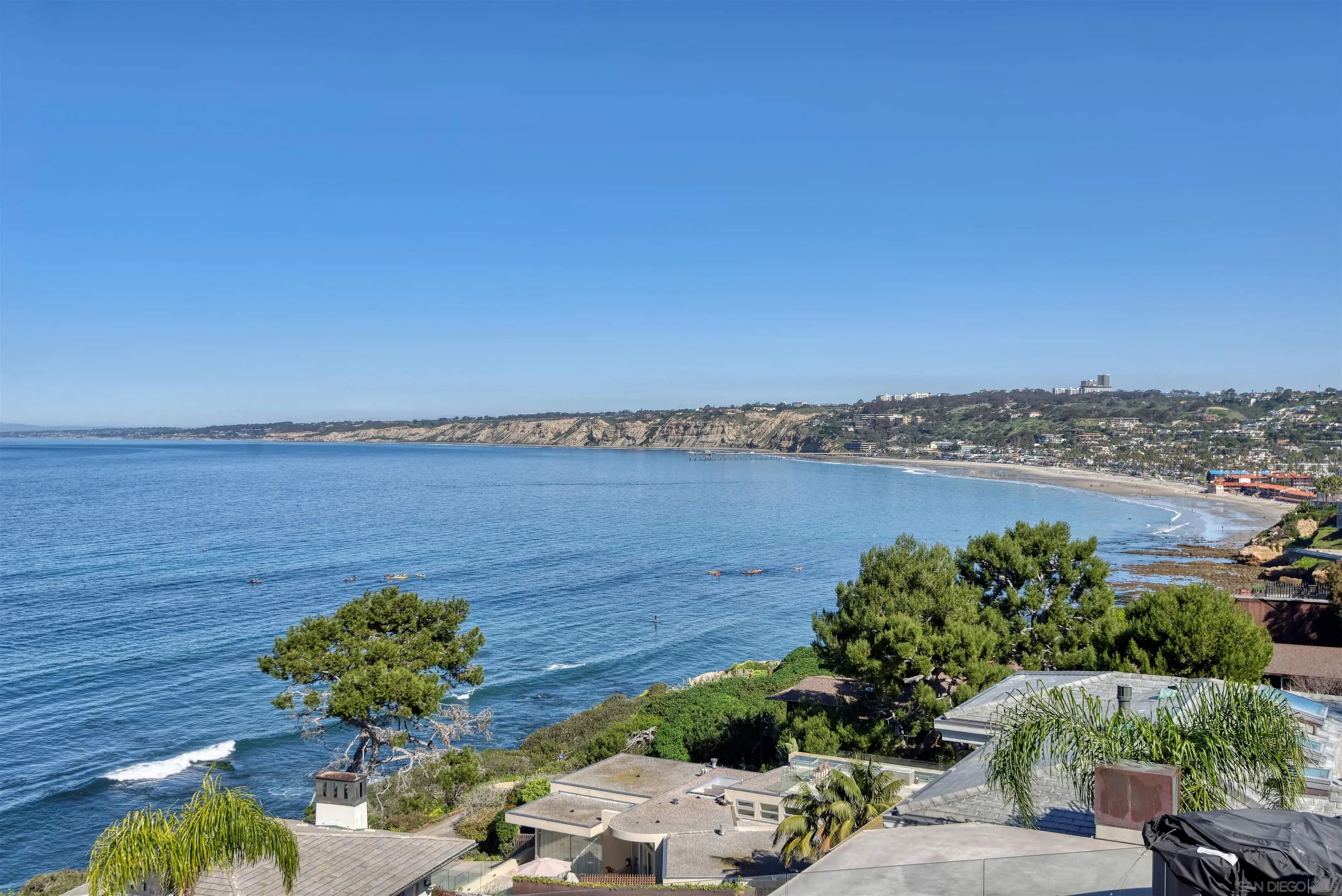 7825 Prospect Place La Jolla, CA 92037 - Photo 32 of 32 a view of a lake with a house in the background