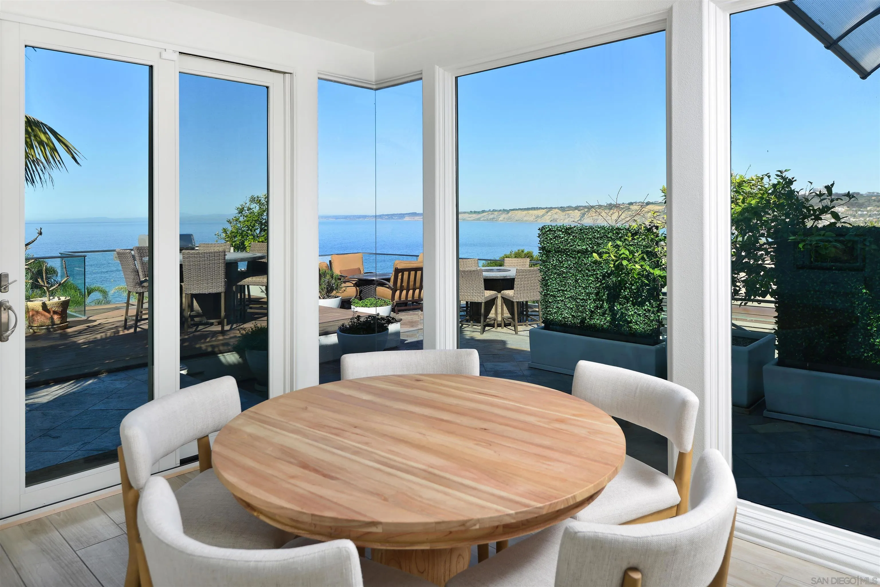 7825 Prospect Place La Jolla, CA 92037 - Photo 7 of 32 a large white table in a living room