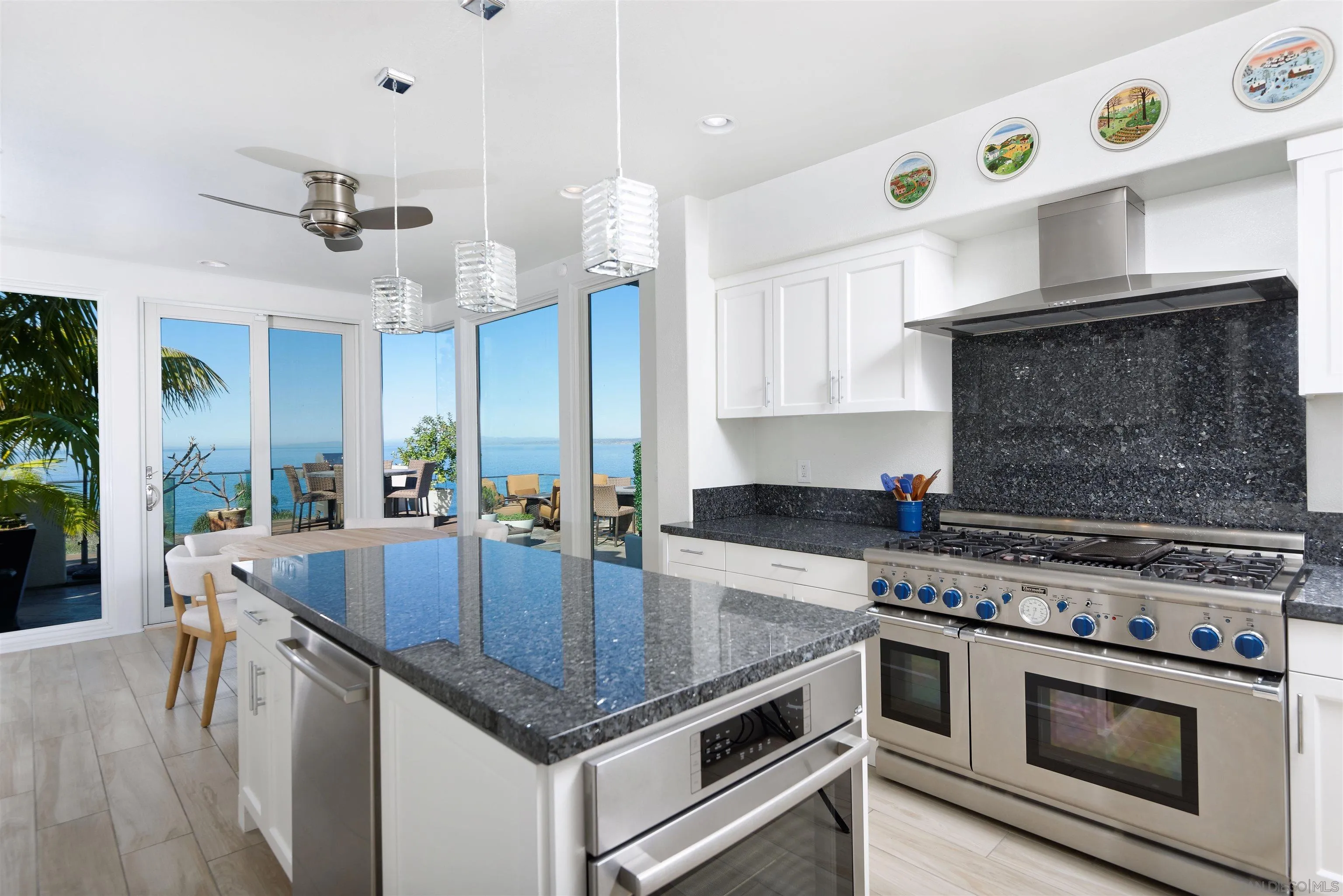 7825 Prospect Place La Jolla, CA 92037 - Photo 10 of 32 a kitchen with a stove and a sink