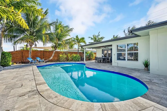 a view of a house with swimming pool