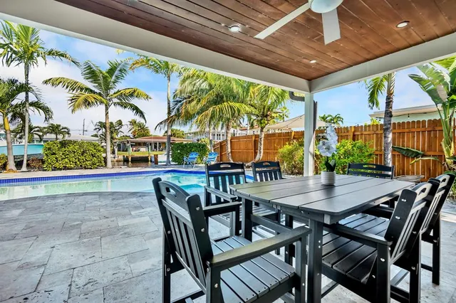 a view of an outdoor dining space with furniture