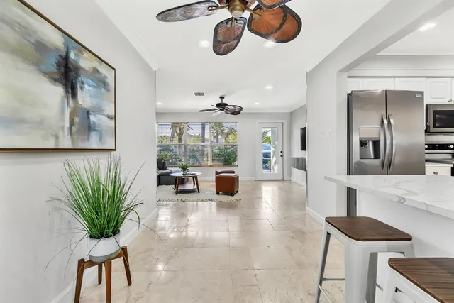a lobby with furniture and a potted plant