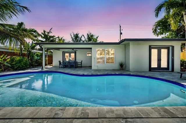 a view of a house with swimming pool