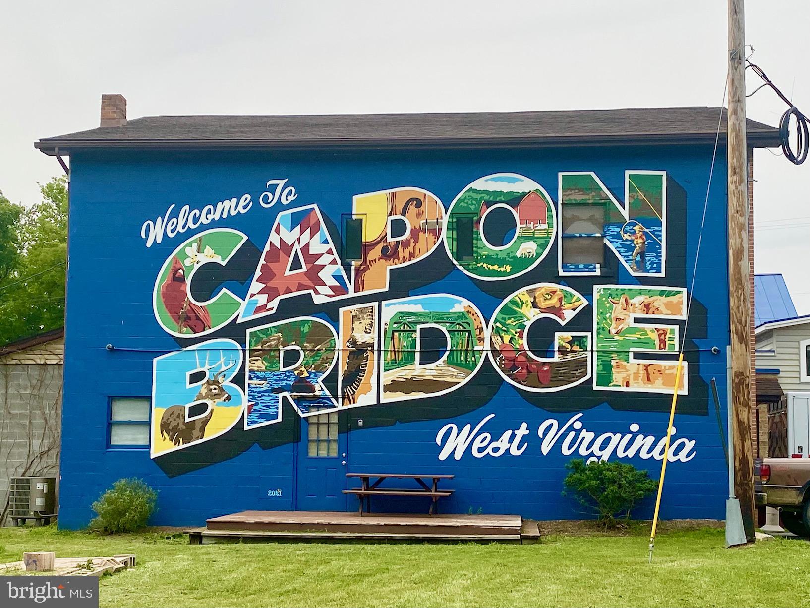 3815 Capon River Road Yellow Spring, WV 26865 - Photo 2 of 21 a sign that is on a wall