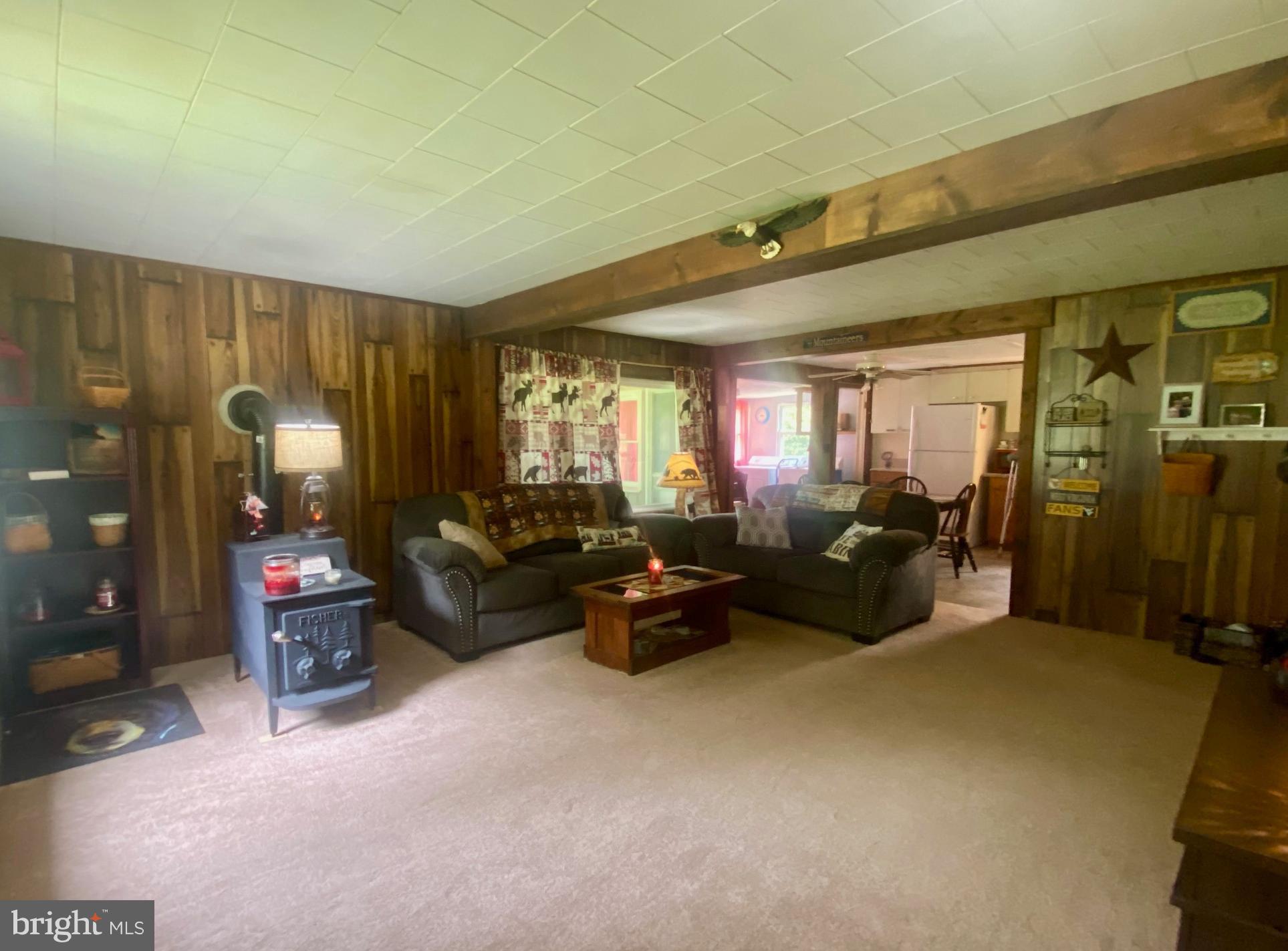 3815 Capon River Road Yellow Spring, WV 26865 - Photo 6 of 21 a living room with furniture and a chandelier
