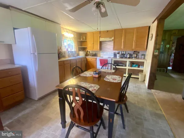 a view of a dining room with furniture and window