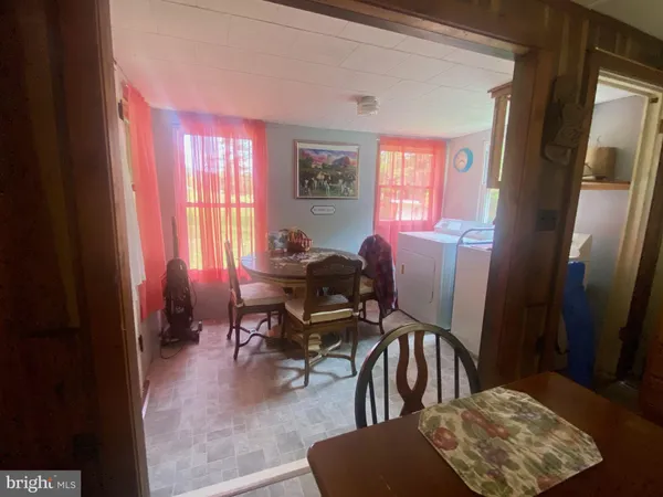 a view of a livingroom with couch and a window