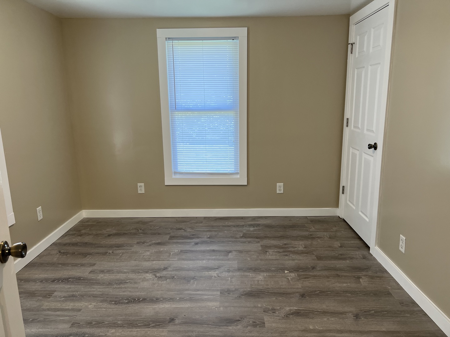 1013 Deephaven Drive Joliet, IL 60432 - Photo 11 of 17 a view of an empty room with wooden floor and a window