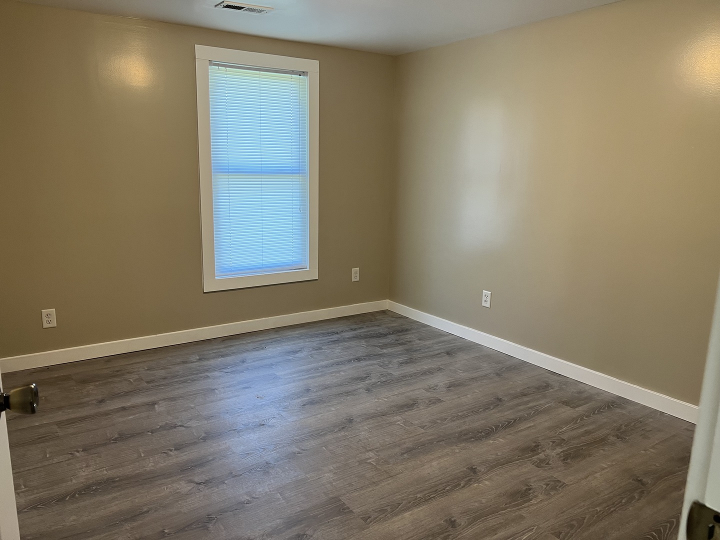 1013 Deephaven Drive Joliet, IL 60432 - Photo 13 of 17 an empty room with wooden floor and windows