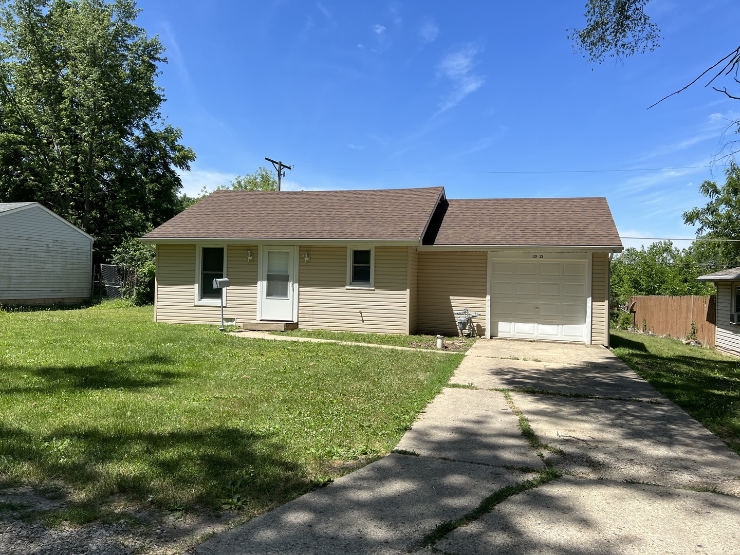 1013 Deephaven Drive Joliet, IL 60432 - Photo 2 of 17 a front view of a house with a yard