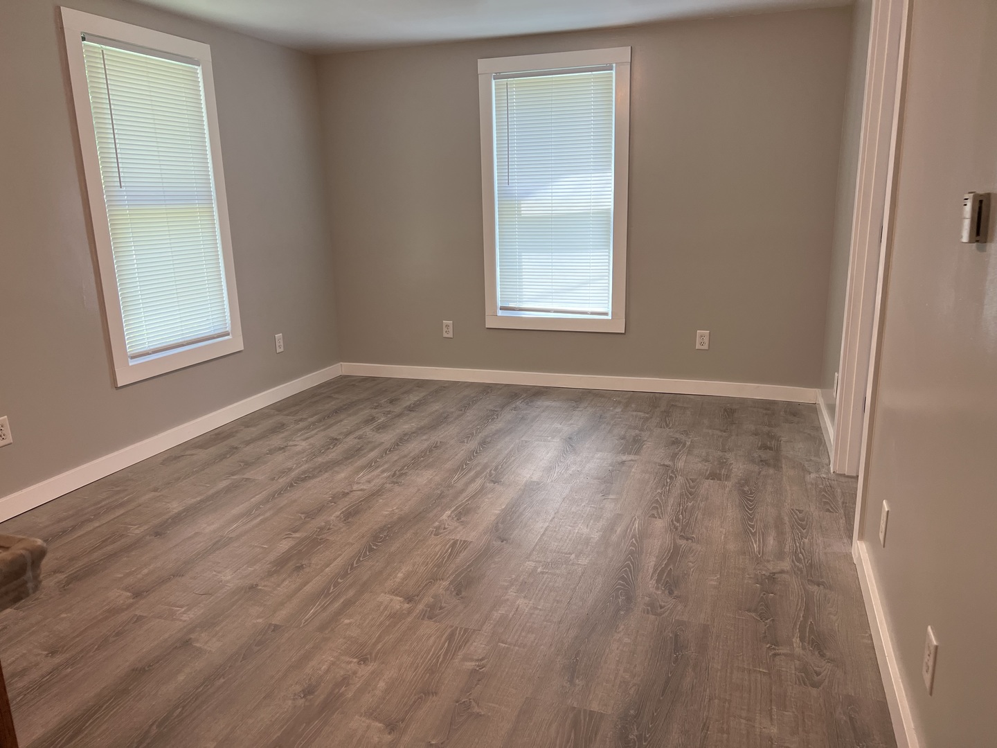 1013 Deephaven Drive Joliet, IL 60432 - Photo 5 of 17 an empty room with wooden floor and windows