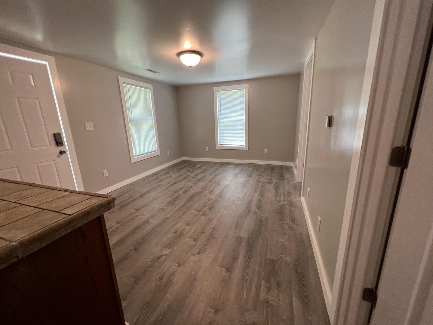 1013 Deephaven Drive Joliet, IL 60432 - Photo 6 of 17 an empty room with wooden floor and windows