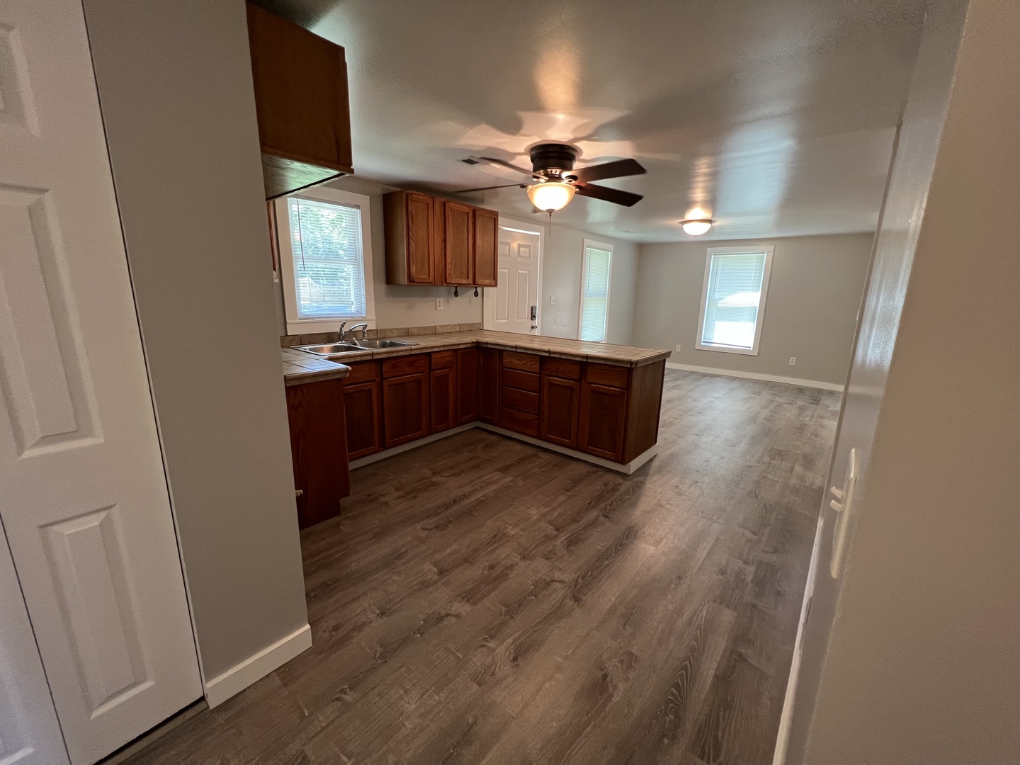 1013 Deephaven Drive Joliet, IL 60432 - Photo 9 of 17 a kitchen with stainless steel appliances granite countertop a refrigerator a sink dishwasher a stove and a dining table with wooden floor