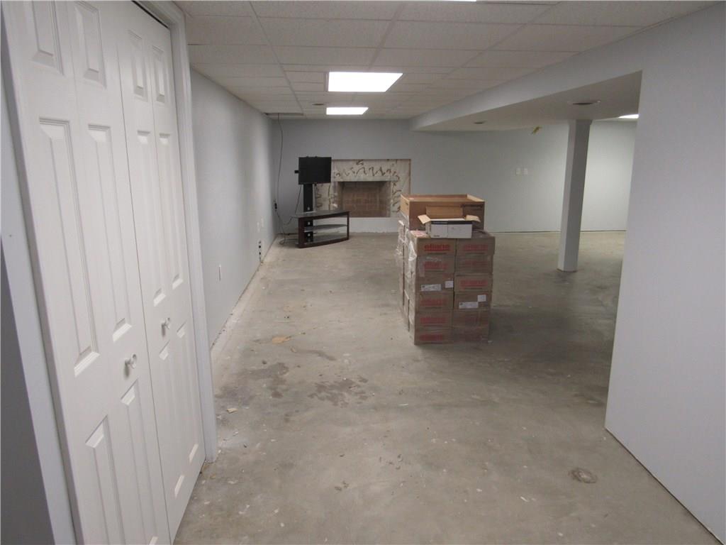 321 Madison Heights Road New Stanton, PA 15672 - Photo 18 of 24 partially finished basement with drywall on the walls and painted, drop ceiling installed, neutral tile ready to be installed .