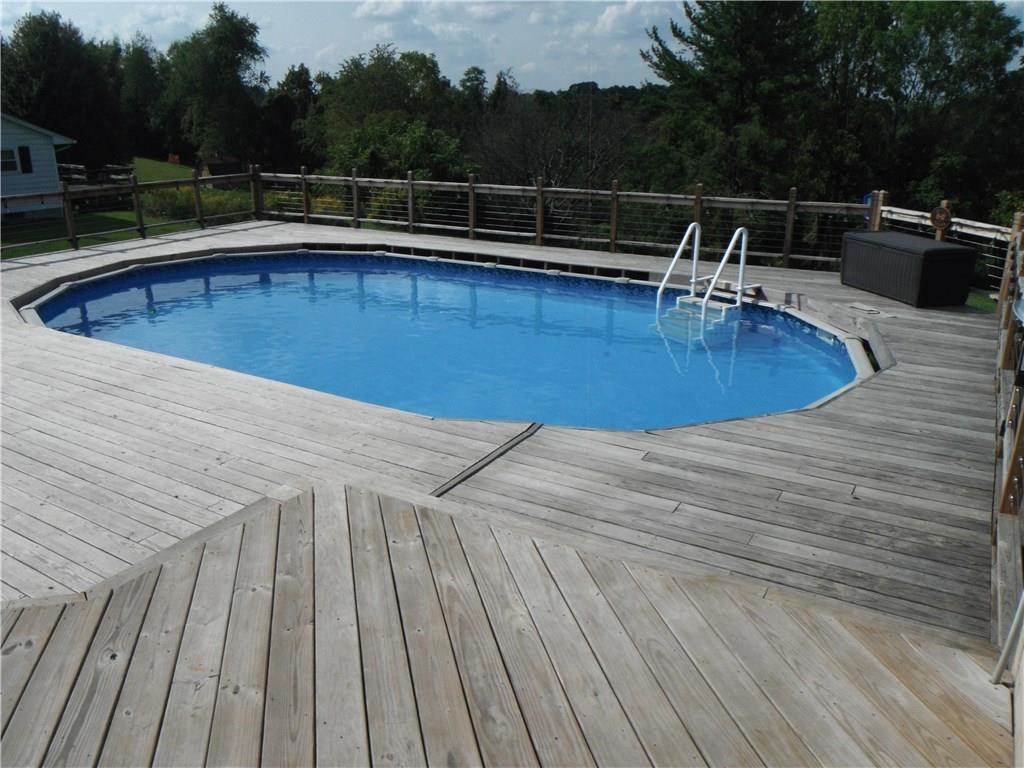 321 Madison Heights Road New Stanton, PA 15672 - Photo 23 of 24 pool with large deck surrounding the pool