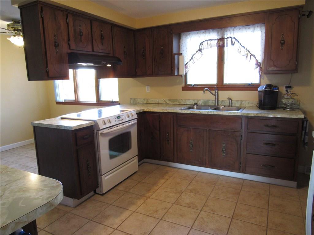 321 Madison Heights Road New Stanton, PA 15672 - Photo 8 of 24 kitchen with double bowl sink. lots of windows to over look the pool in the backyard