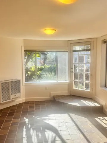 a view of empty room with windows and city view